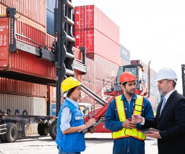 Port-workers-discussing-port-operations-management-software