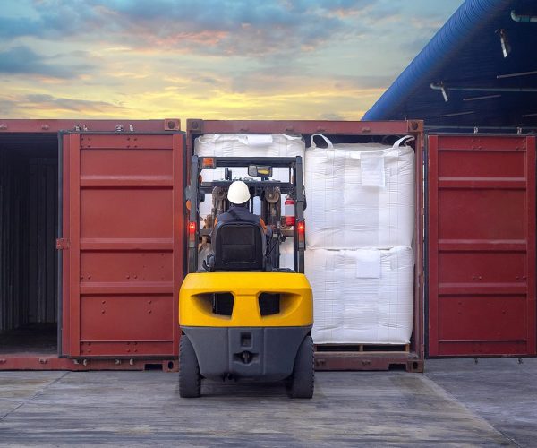 Tapioca in  jumbo bags are stuffing in container by forklift at stuffing yard.